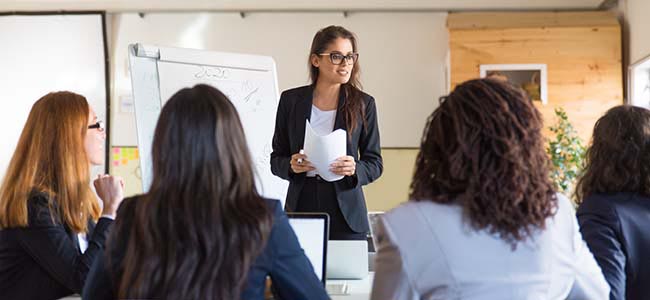 Woman teacher in class with students
