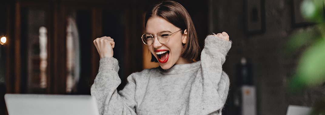 Woman making gesture of success
